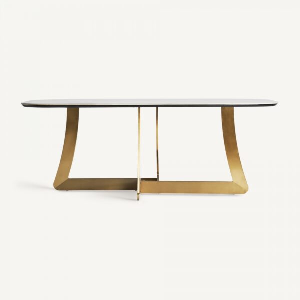 Elegante mesa de comedor con estructura metálica en acabado dorado y sobre de mármol, diseño premium de la colección exclusiva de Vical Home. Ideal para espacios sofisticados y modernos.